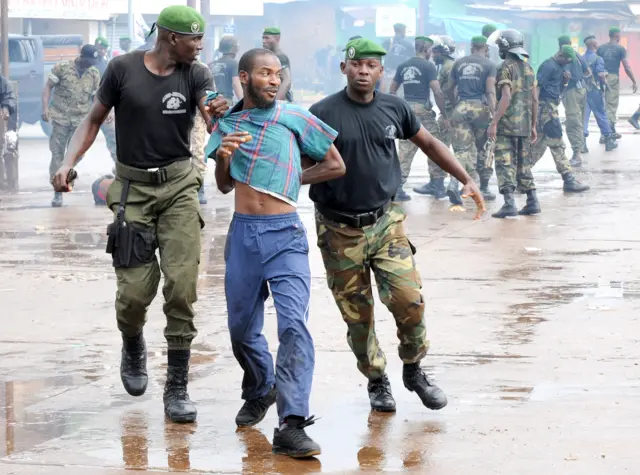 Archive photo: soldiers manhandling a protesters in Conakry on 28 September 2009