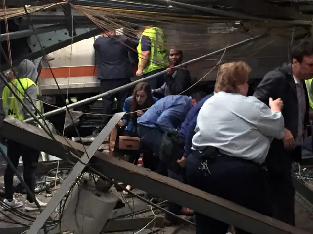 Passengers rush to safety after a NJ Transit train crashed in to the platform at the Hoboken Terminal in New Jersey.