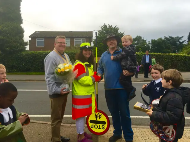 Lollipop lady, Kate, receiving gifts for saving child