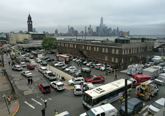 The skyline of New York"s borough of Manhattan is seen behind the Hoboken, N.J. rail station after a train crash at the facility on Thursday, Sept. 29, 2016