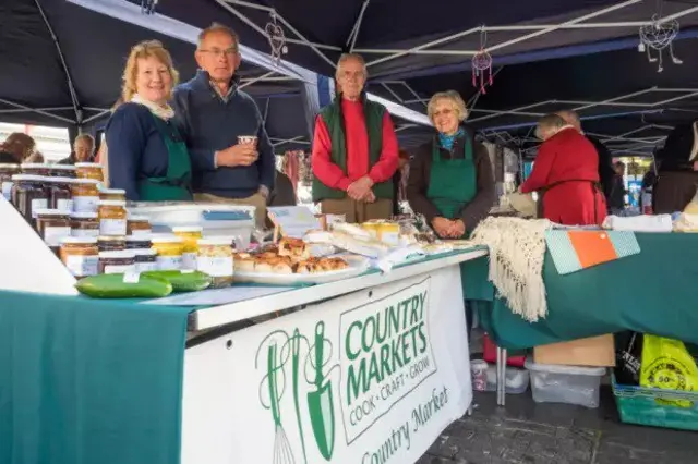 Stall showing bakery produce and jars of products