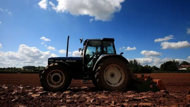 Tractor and driver at work