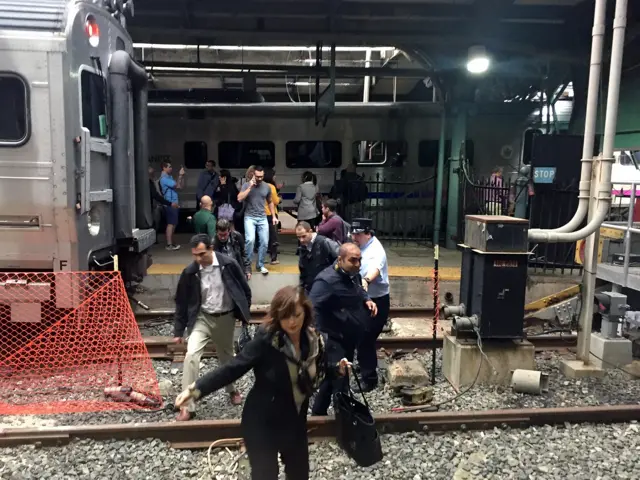 Passengers rush to safety after a NJ Transit train crashed in to the platform at the Hoboken Terminal in New Jersey.