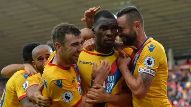 Christian Benteke (centre) celebrates with team-mates