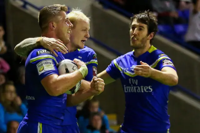 Tom Lineham celebrates his try with Rhys Evans and Stefan Ratchford