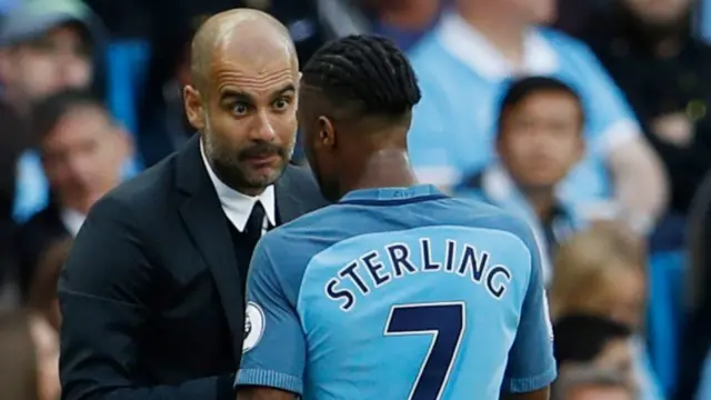 Pep Guardiola talks to Raheem Sterling