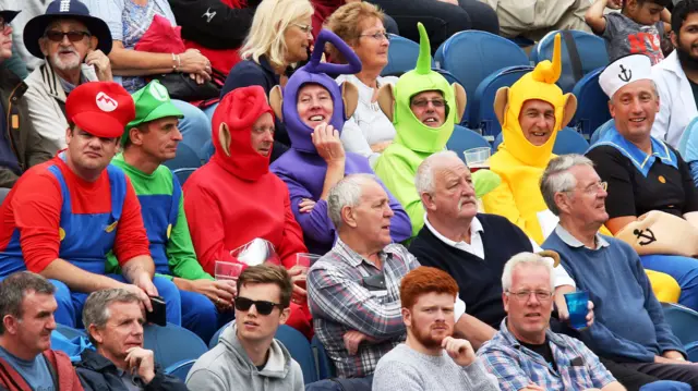 Spectators in fancy dress