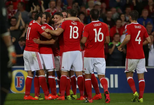 Wales celebrating after their second goal in the first half