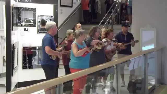 Ukulele players in John Lewis in Norwich