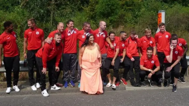 Bride with football team