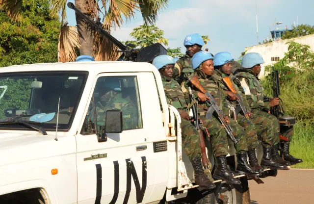 U.N. peacekeepers ride on their truck in Juba, South Sudan