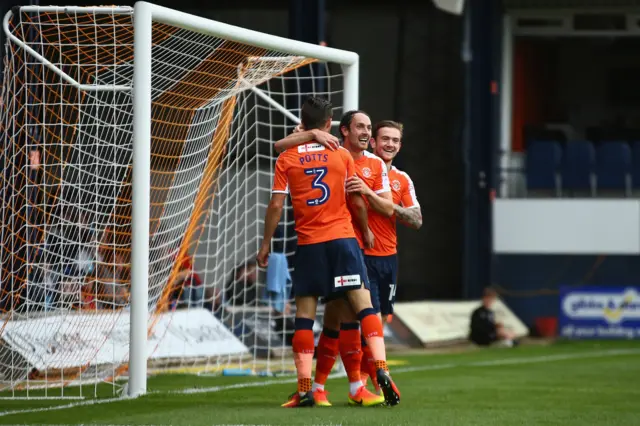 Danny Hylton celebrates with team mates