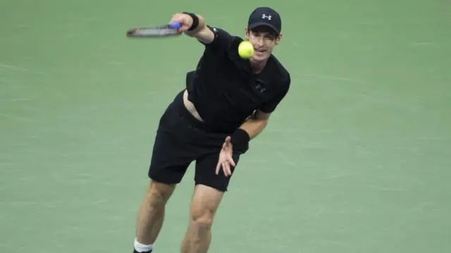 Andy Murray serves