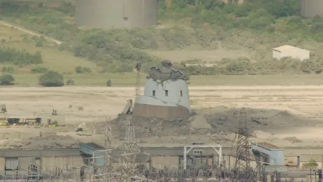 Grain chimney being demolished