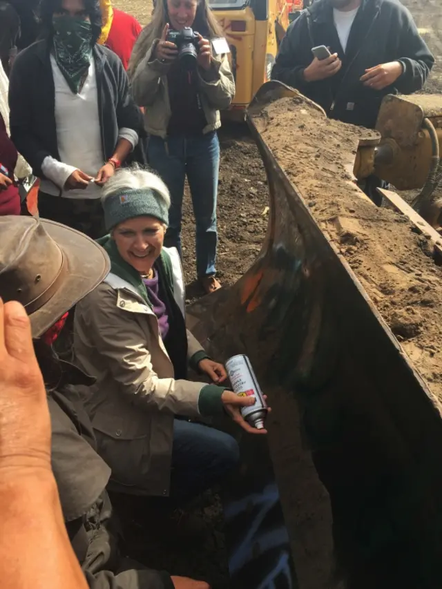 "I endorse this message", Jill Stein wrote on a bulldozer in red spray paint