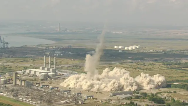 Grain chimney being demolished