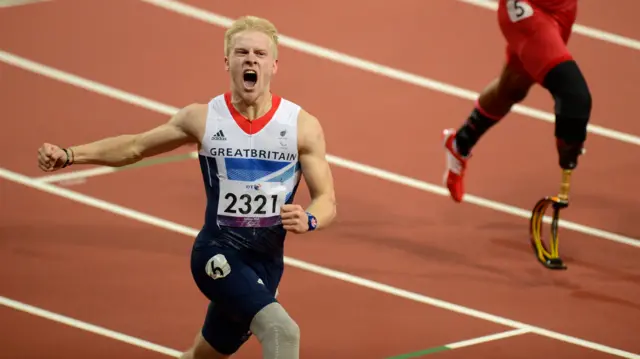 ParalympicGB's Jonnie Peacock celebrates after winning gold in the men's 100m T44 during London 2012