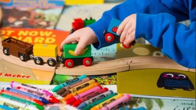 Child playing with trains