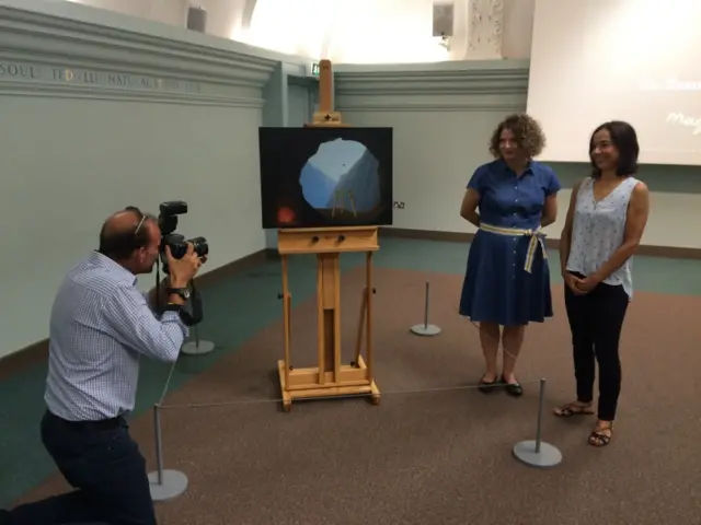 Curator Dr Giorgia Bottinelli and conservator Alice Tavares da Silva with Magritte"s La Condition Humaine