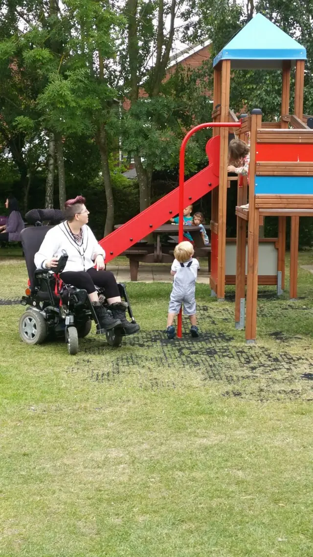 Rachel Mitton in a park in her stolen wheelchair