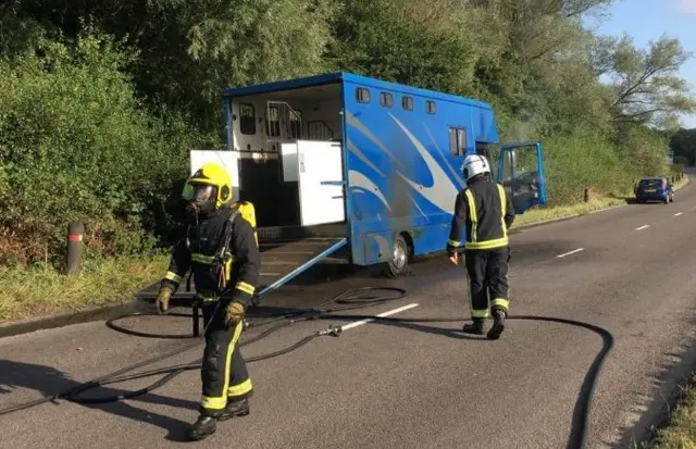 Firefighters tackle horse box fire