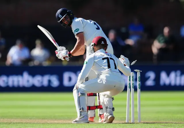 Chris Wright of Warwickshire survives a stumping chance from Ryan Davies of Somerset during Day Three