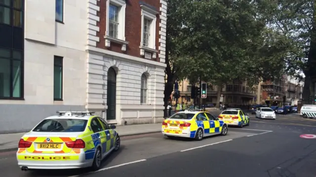 Police convoy outside Westminster Magistrates' Court