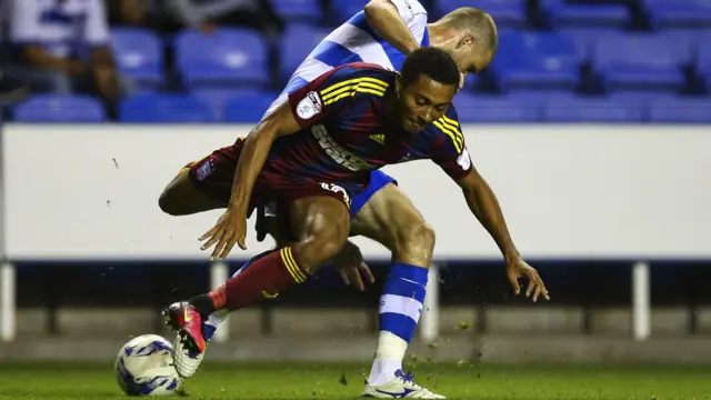 Joey van den Berg of Reading tackles Grant Ward of Ipswich Town