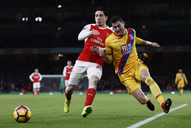 Hector Bellerin vies for the ball