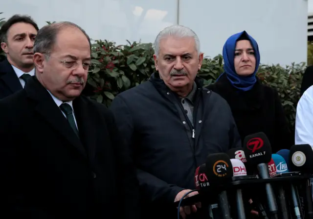 Turkish Prime Minister Binali Yildirim (C), accompanied by Health Minister Recep Akdag and Minister of Family and Social Policies Fatma Betul Sayan Kaya, talks to media after he visited survivors of the nightclub attack at a hospital in Istanbul, Turkey, January 1, 2017.
