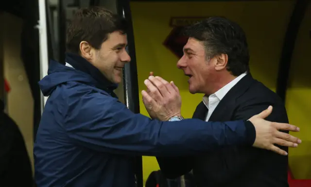 Managers embrace before kick-off