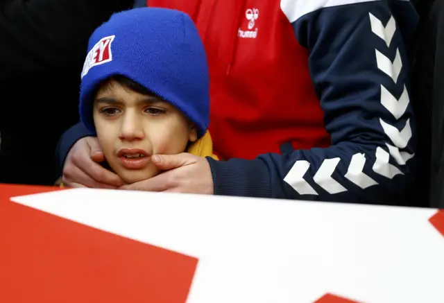 A boy reacts at the funeral of Ayhan Arik, a victim of an attack by a gunman at Reina nightclub, in Istanbul, Turkey, January 1, 2017