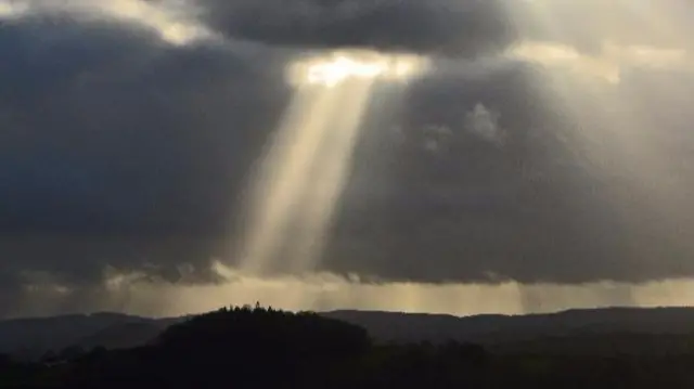 Sun breaking through cloud