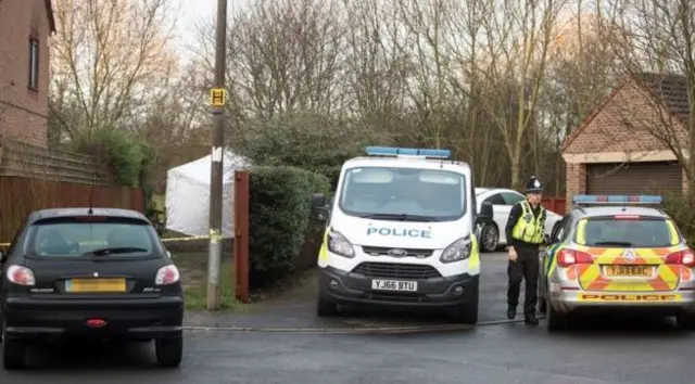 Police car and van at scene