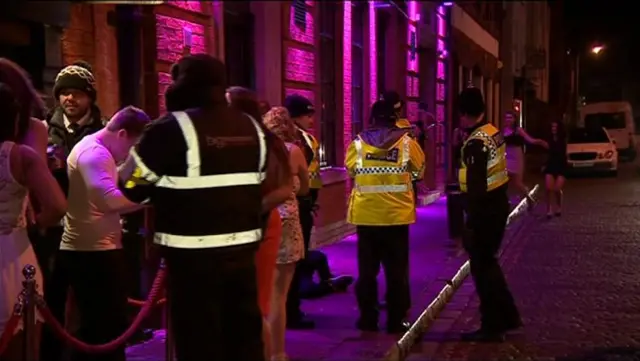 Police and bouncers outside a club