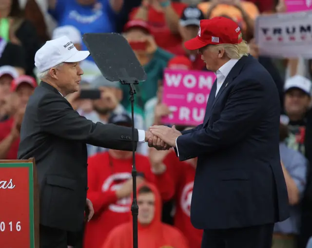 Sen Sessions, left, shakes Donald Trump's hand during the campaign