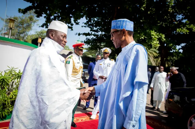 Gambian President Yahya Jammeh receives Nigeria"s President Muhammadu Buhari at the presidential palace in Banjul, Gambia December 13, 2016