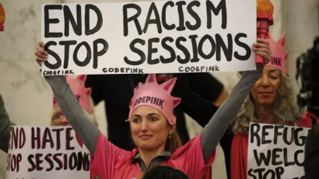 Protesters hold slogans on Capitol Hill in Washington