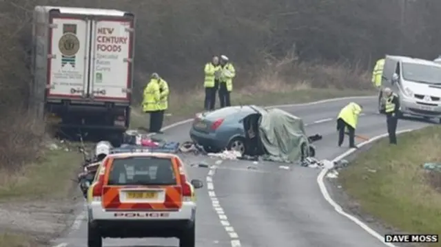 Damaged car and lorry on the A18