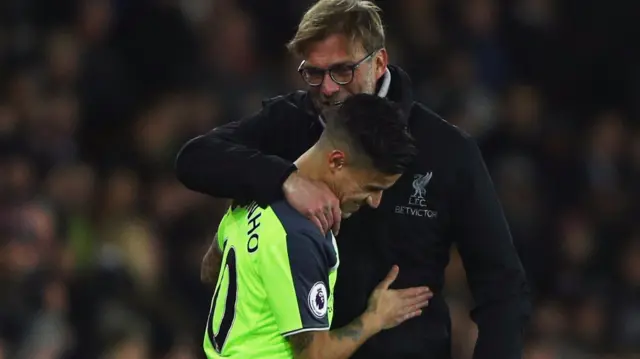 Jurgen Klopp manager of Liverpool embraces substitute Philippe Coutinho