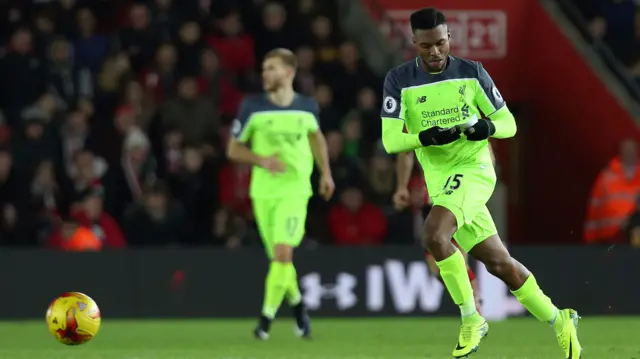 Daniel Sturridge of Liverpool reads a piece of paper