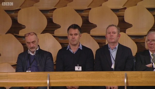 Kenny Logan and his team in the gallery