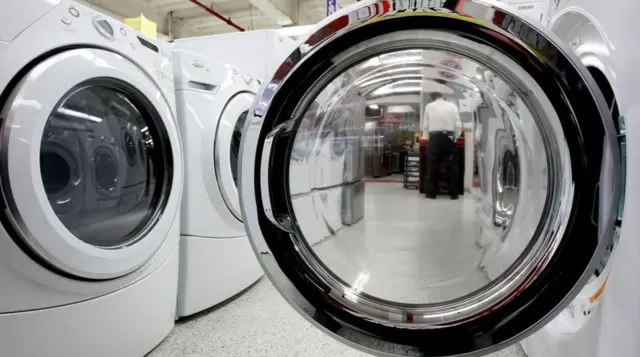 Clothes dryers displayed in an appliance store