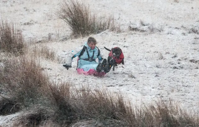 A sledger at the base of Pont ar Daf in the Brecon Beacons: