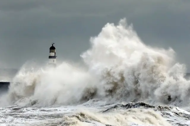 Waves crash into the sea wall at Seaham Harbour in the north east of England