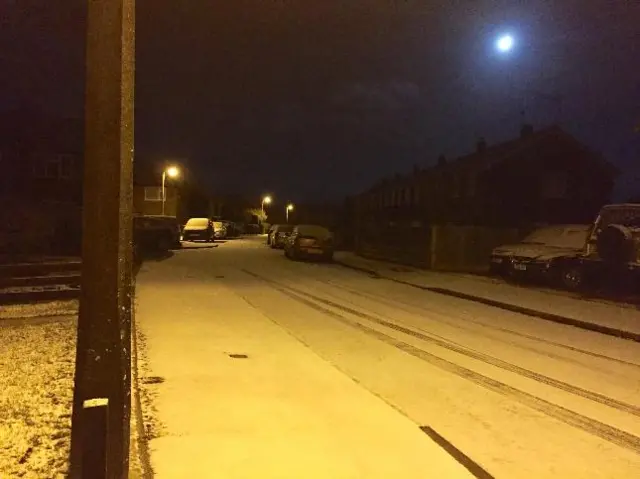 Snow on gardens, cars and roads in Newport