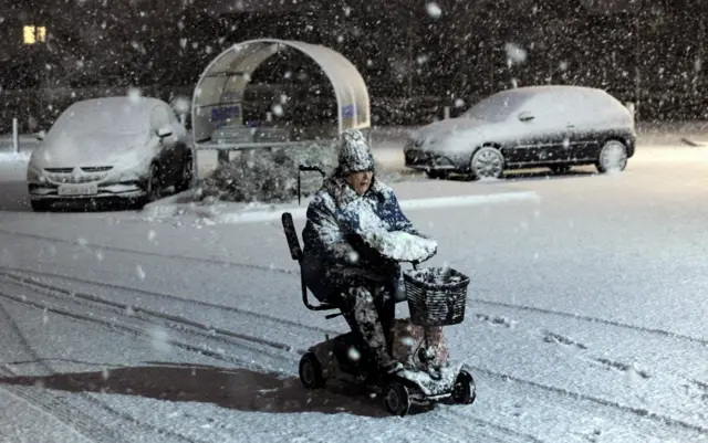 Woman on mobility scooter