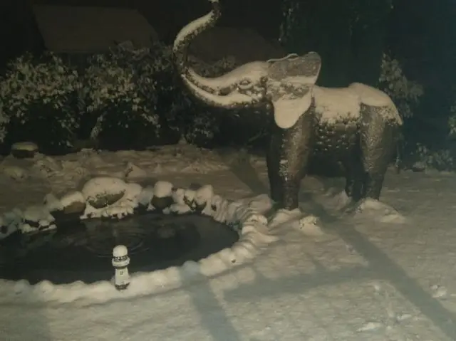 An elephant (statue!) enjoys the snow in Ford Green.