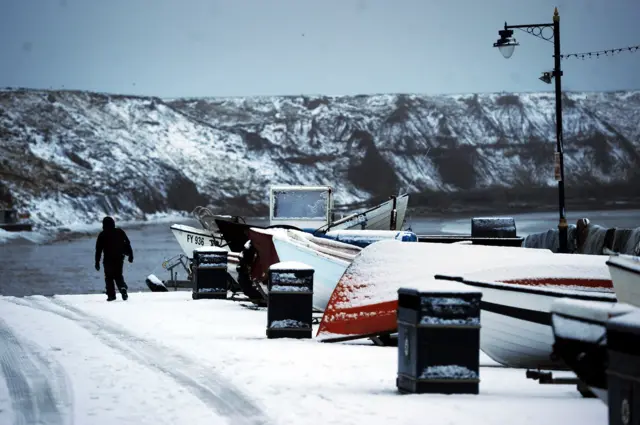 Boats in snow in Filey