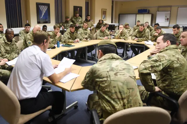 Soldiers in meeting